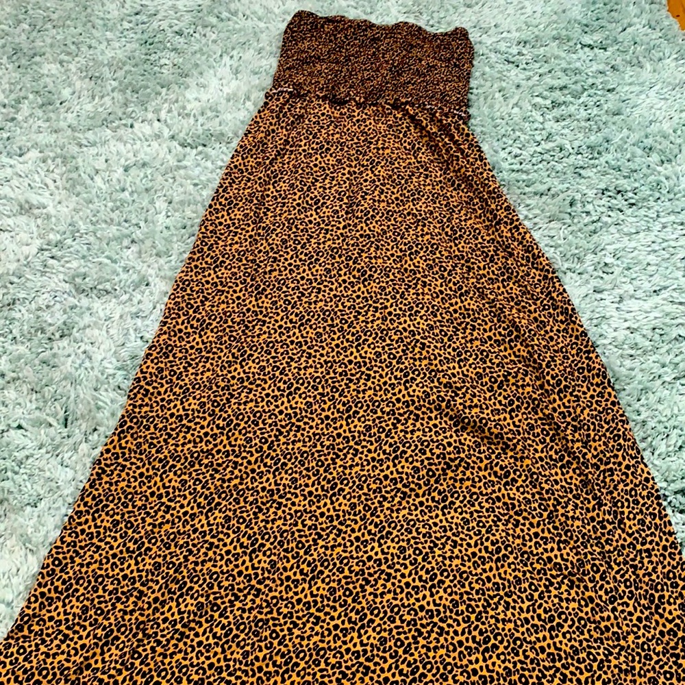Sleeveless leopard print dress with a long skirt and textured bodice